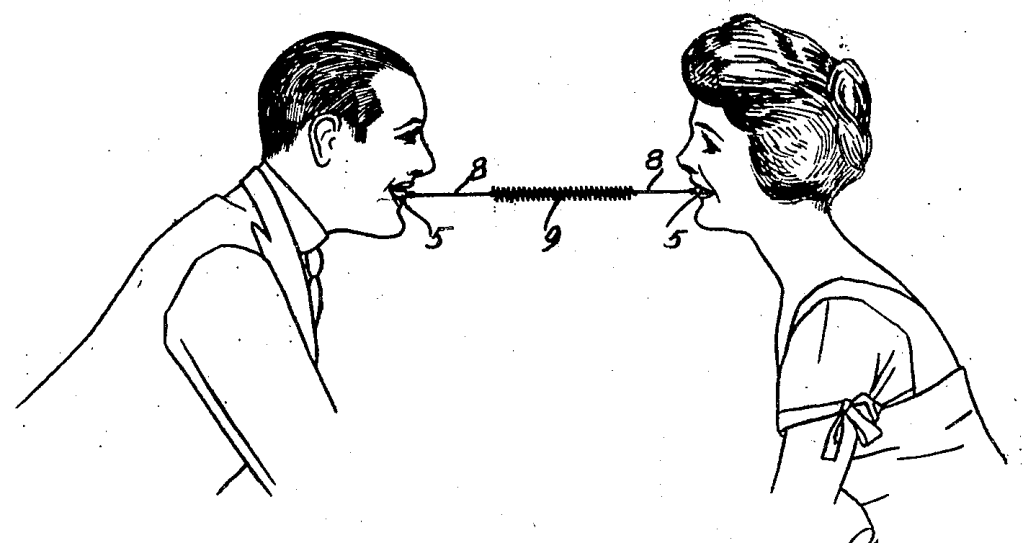 Two people facing one another. Each bites onto a respective side of a device with a spring between them. 